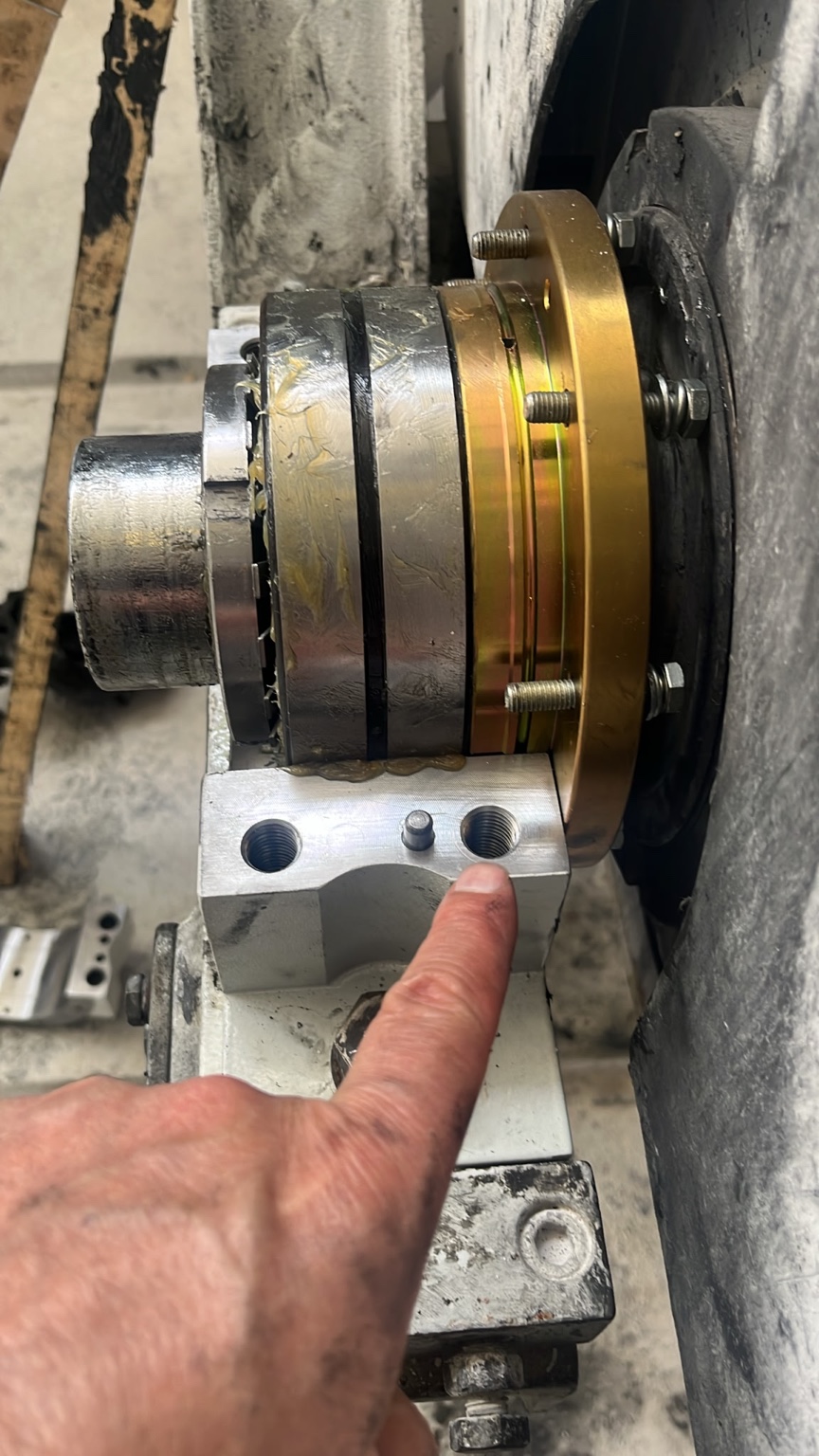 Close view of a machine shaft and coupling assembly